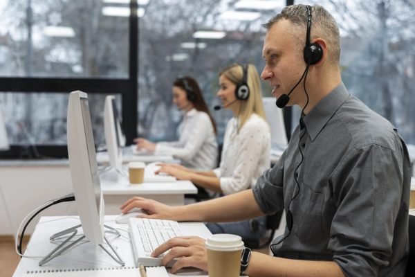 colleagues-working-together-call-center-office-with-coffee-min colleagues-working-together-call-center-office-with-coffee-min